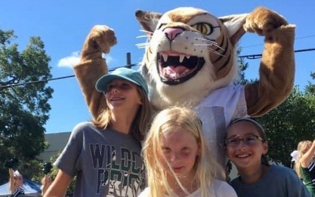 Whiskers the NBCA Mascot guarding the kids!